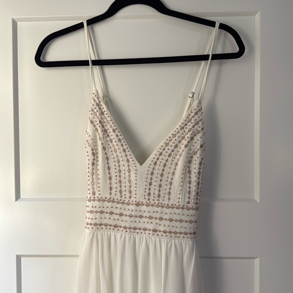 White maxi dress with beaded embellishments